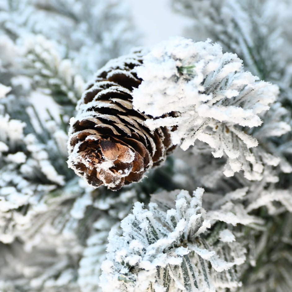 2-foot Flocked Christmas Tree With A Pot Base, 30 Warm White LED Lights, 189 Branch Tips, PE PVC Branches, And 3 Pinecones